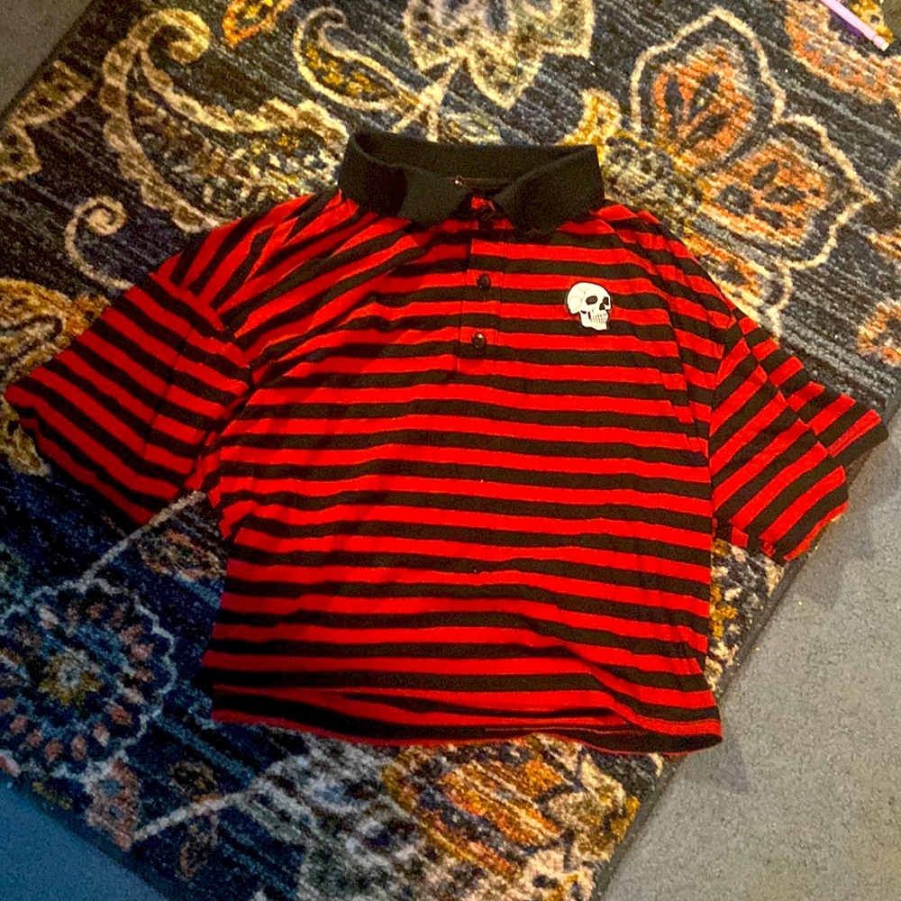 Red and black striped shirt with skull design
